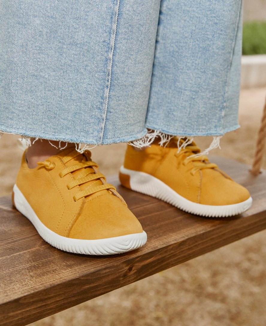 Big Kids' KNX Leather Sneaker | Gold Flame/Star White - Image 9